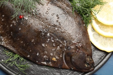 Photo of Fresh raw flounder fish and spices on table, top view. Seafood