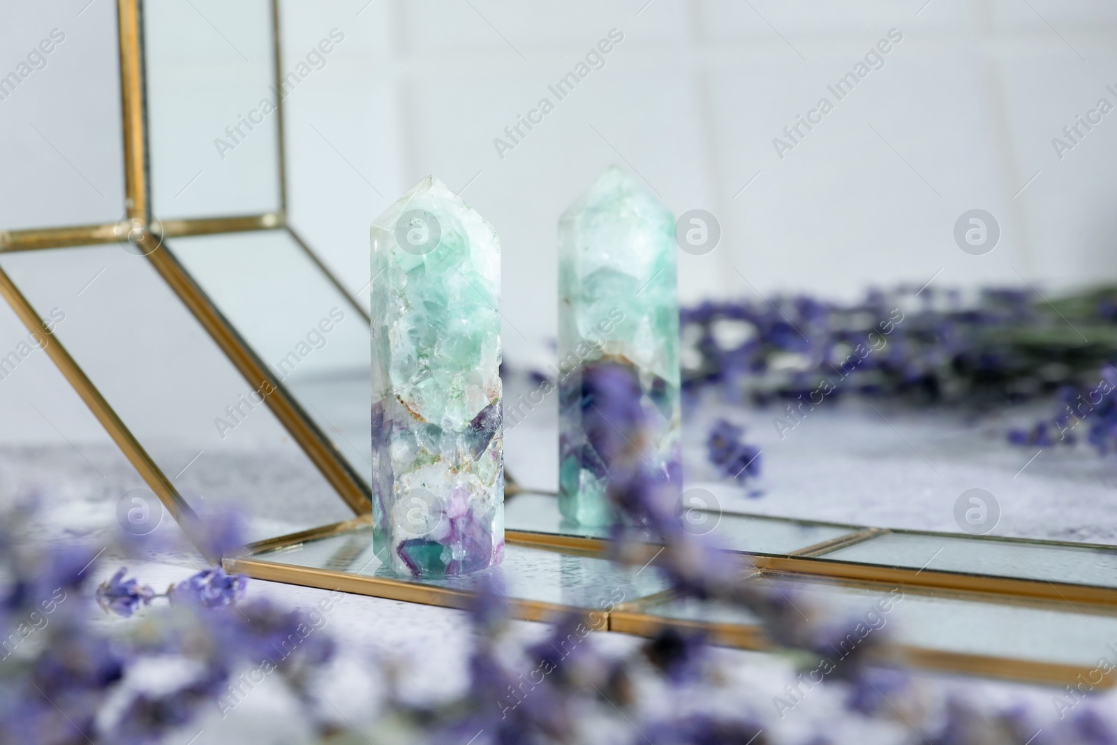Photo of Aura. Beautiful fluorite and lavender on white table, closeup. Space for text