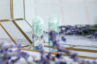 Photo of Aura. Beautiful fluorite and lavender on white table, closeup. Space for text