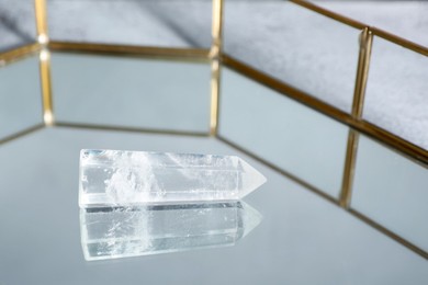 Photo of Aura. Beautiful crystal on glass tray, closeup