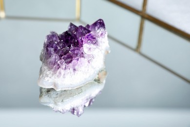 Photo of Aura. Beautiful amethyst on glass tray, closeup. Space for text