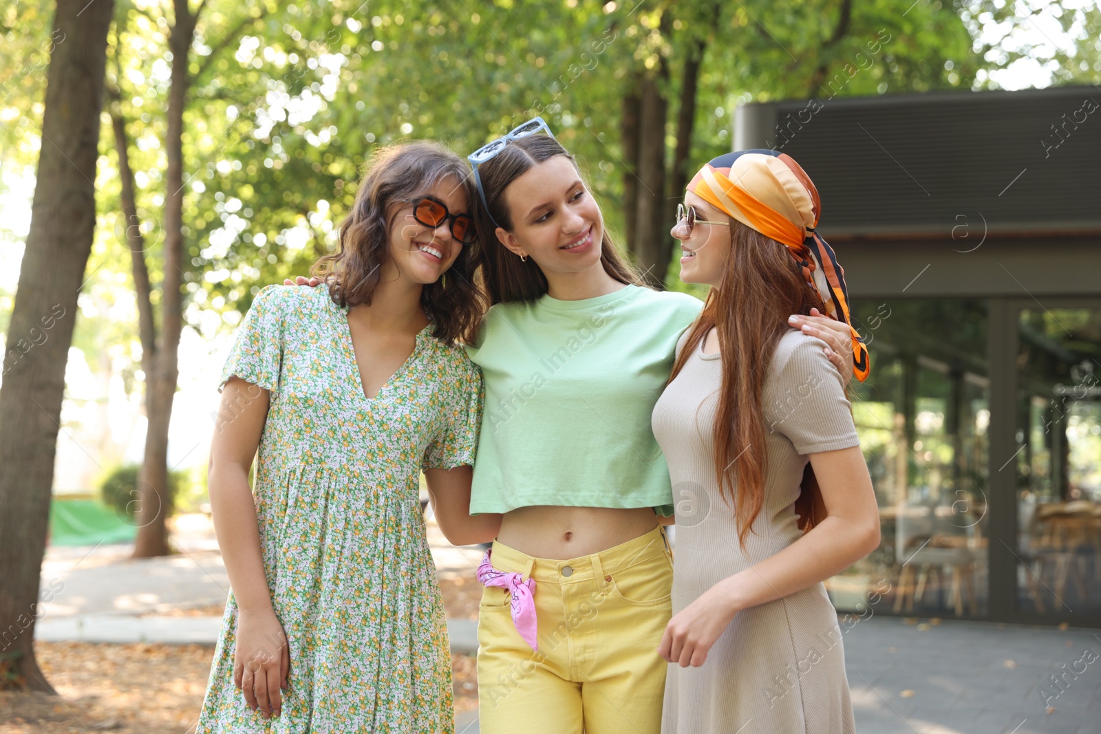 Portrait of happy friends with sunglasses outdoors Photo of Portrait of happy friends with sunglasses outdoors