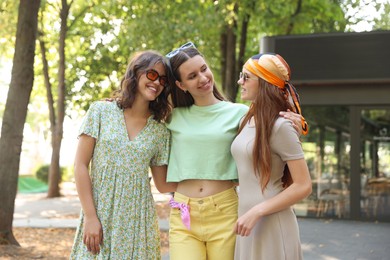 Photo of Portrait of happy friends with sunglasses outdoors