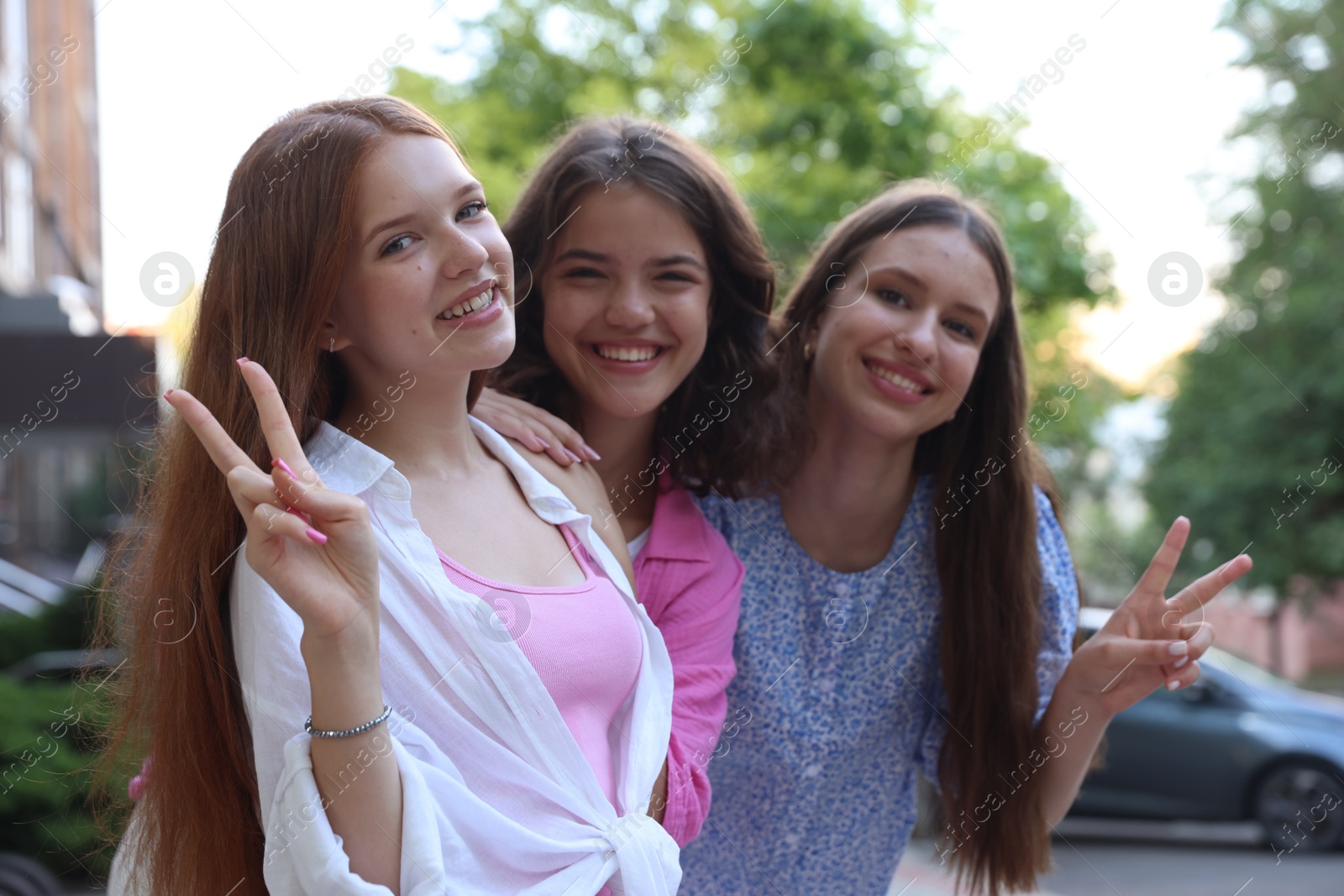 Photo of Portrait of happy friends on city street