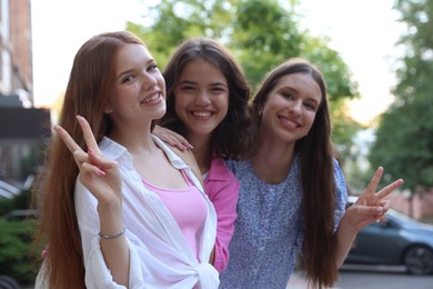 Photo of Portrait of happy friends on city street