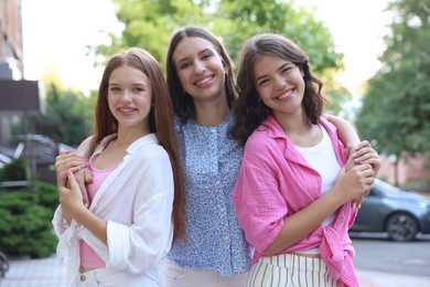 Photo of Portrait of happy friends on city street
