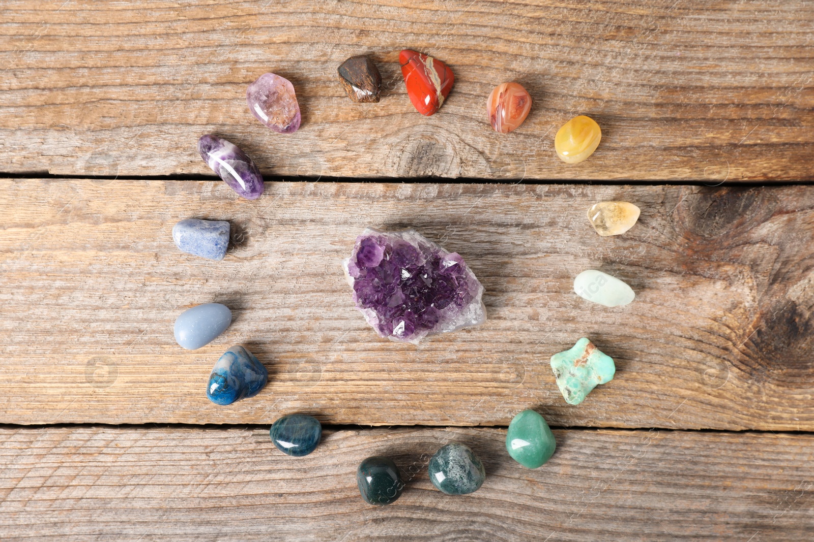 Aura. Different natural mineral stones on wooden table, flat lay Photo of Aura. Different natural mineral stones on wooden table, flat lay