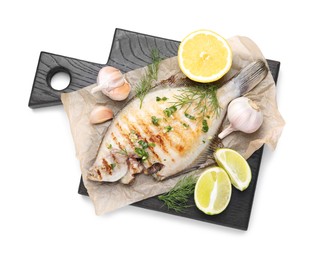 Photo of Tasty roasted flounder fish with spices isolated on white, top view. Homemade seafood dish
