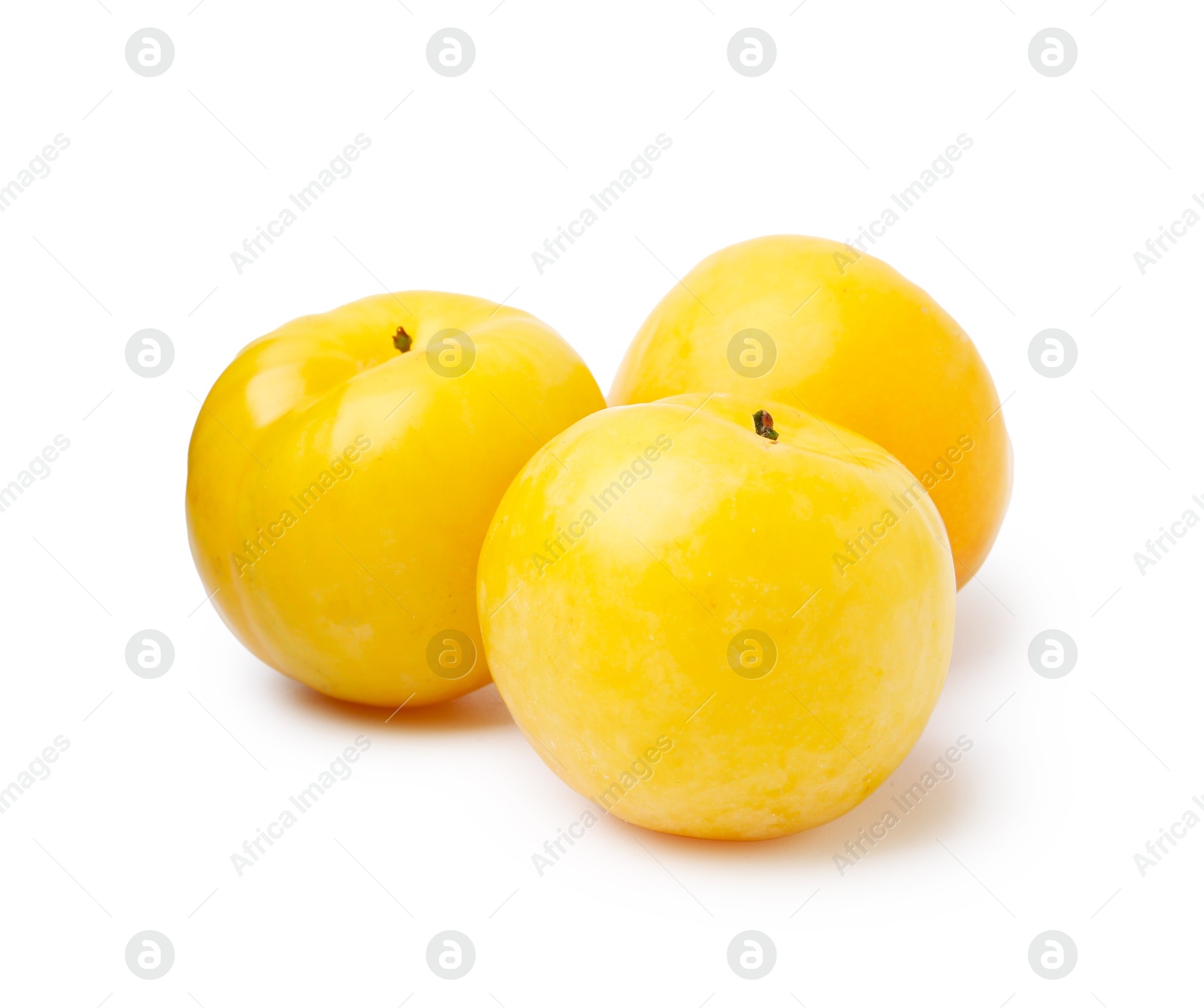 Whole ripe yellow cherry plums isolated on white Photo of Whole ripe yellow cherry plums isolated on white