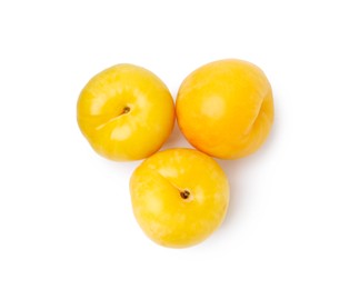 Photo of Whole ripe yellow cherry plums isolated on white, top view