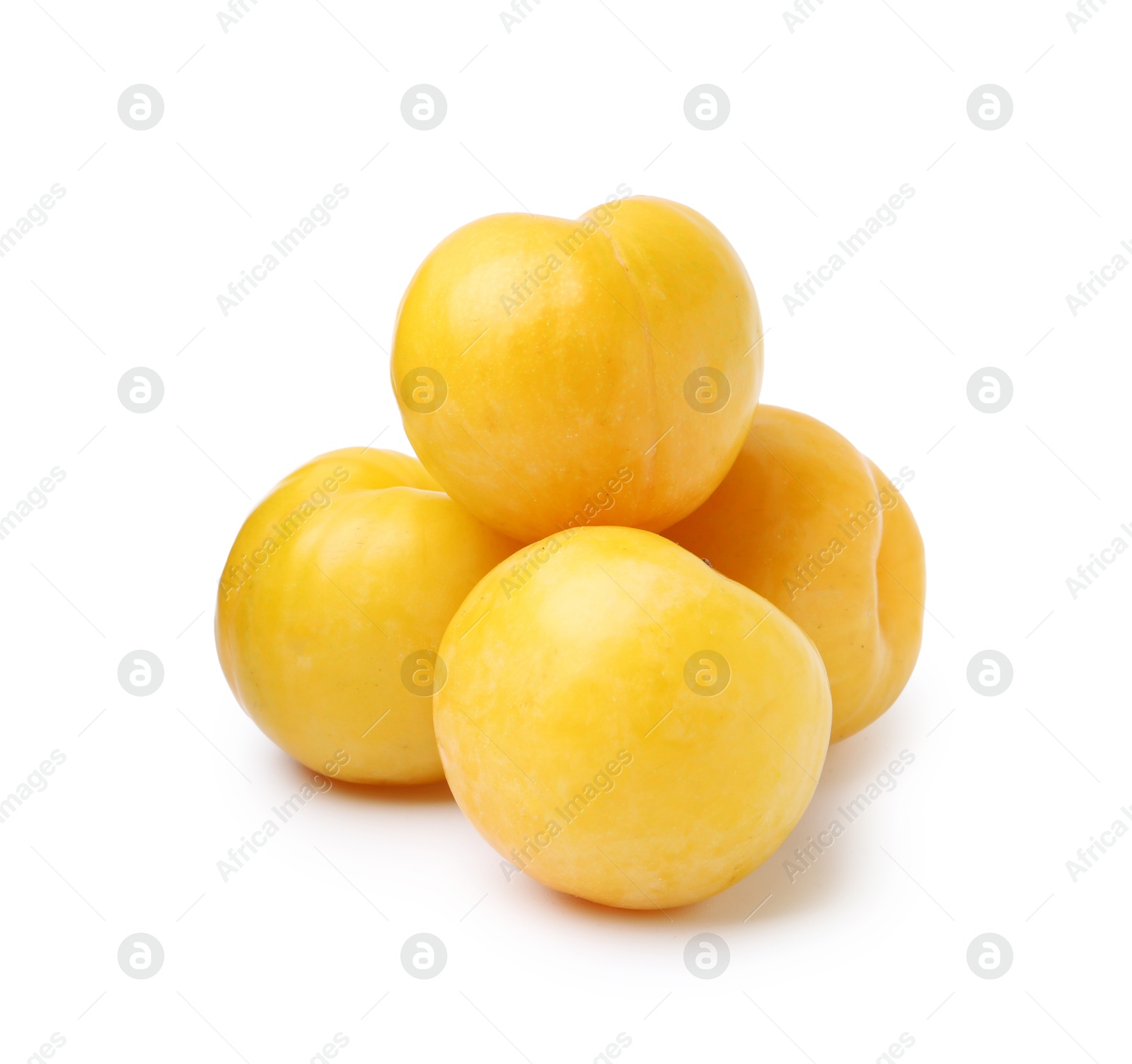 Whole ripe yellow cherry plums isolated on white Photo of Whole ripe yellow cherry plums isolated on white