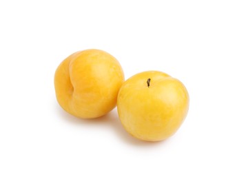 Photo of Whole ripe yellow cherry plums isolated on white