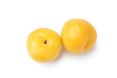 Photo of Whole ripe yellow cherry plums isolated on white