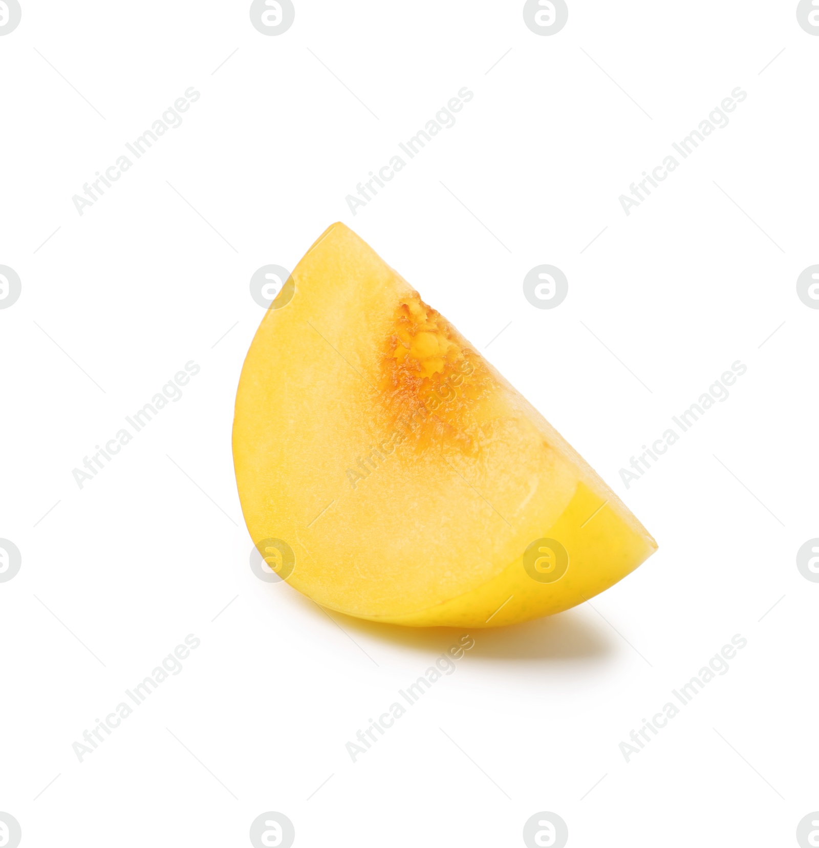 Piece of yellow cherry plum isolated on white Photo of Piece of yellow cherry plum isolated on white