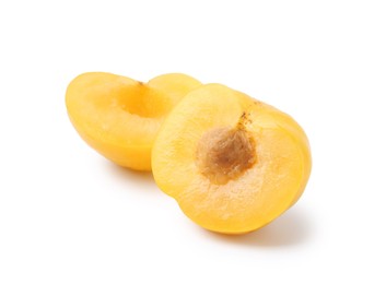 Photo of Halves of yellow cherry plum isolated on white