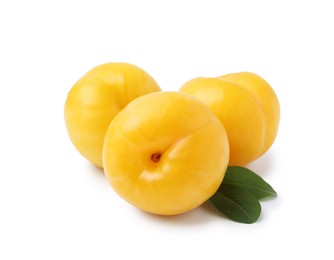 Photo of Yellow cherry plums with leaves isolated on white