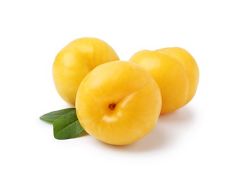 Photo of Yellow cherry plums with leaves isolated on white
