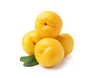 Photo of Yellow cherry plums with leaves isolated on white