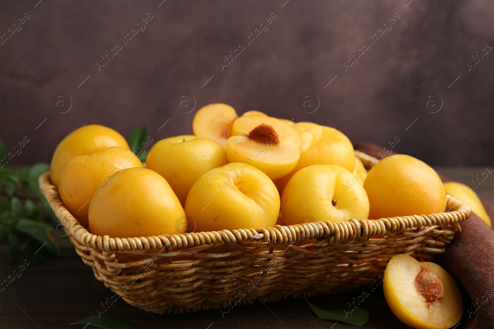 Ripe yellow cherry plums on wooden table, closeup. Space for text Photo of Ripe yellow cherry plums on wooden table, closeup. Space for text