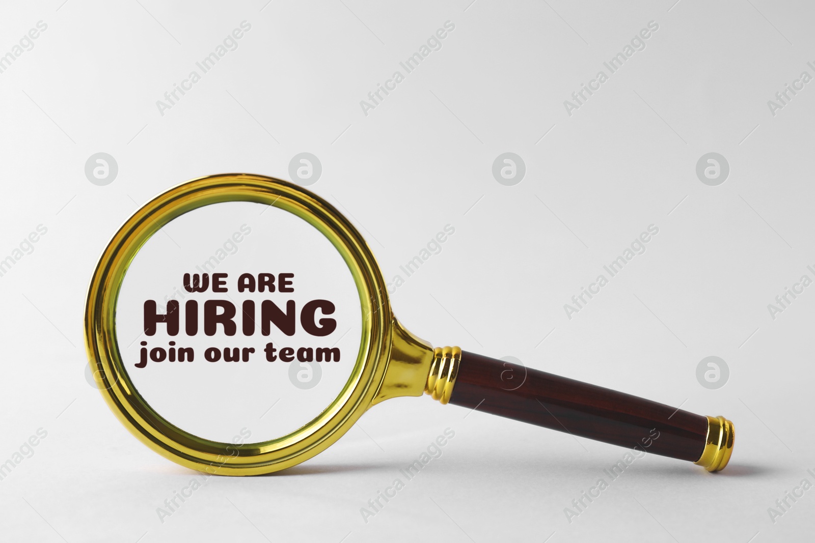 Image of We are hiring, join our team. Magnifying glass with inscription inside on white background