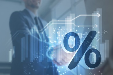 Illustration of Percent sign, graph and businesspeople shaking hands, double exposure