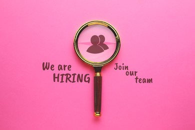 Image of We are hiring, join our team. Magnifying glass with human icon and inscription on pink background, top view