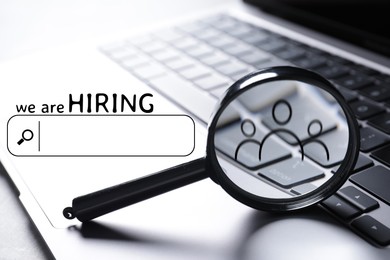 Image of We are hiring. Magnifying glass with human icon inside, search bar and laptop
