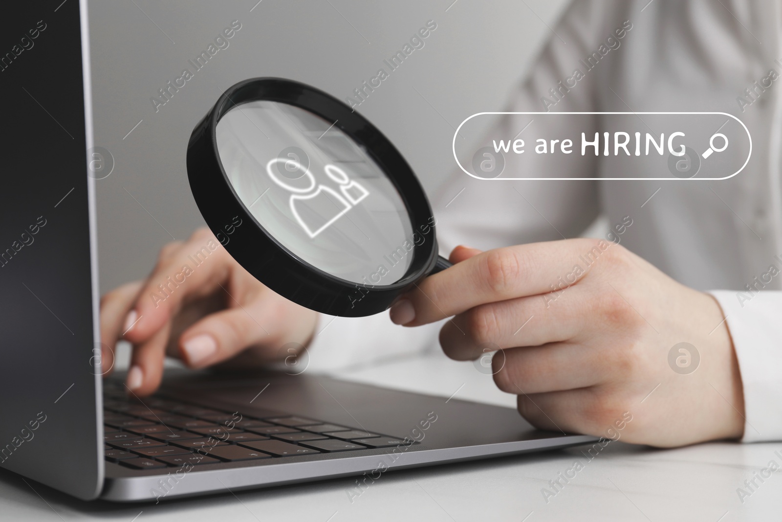 Image of We are hiring, inscription in search bar. Woman with magnifying glass working on laptop at table, closeup
