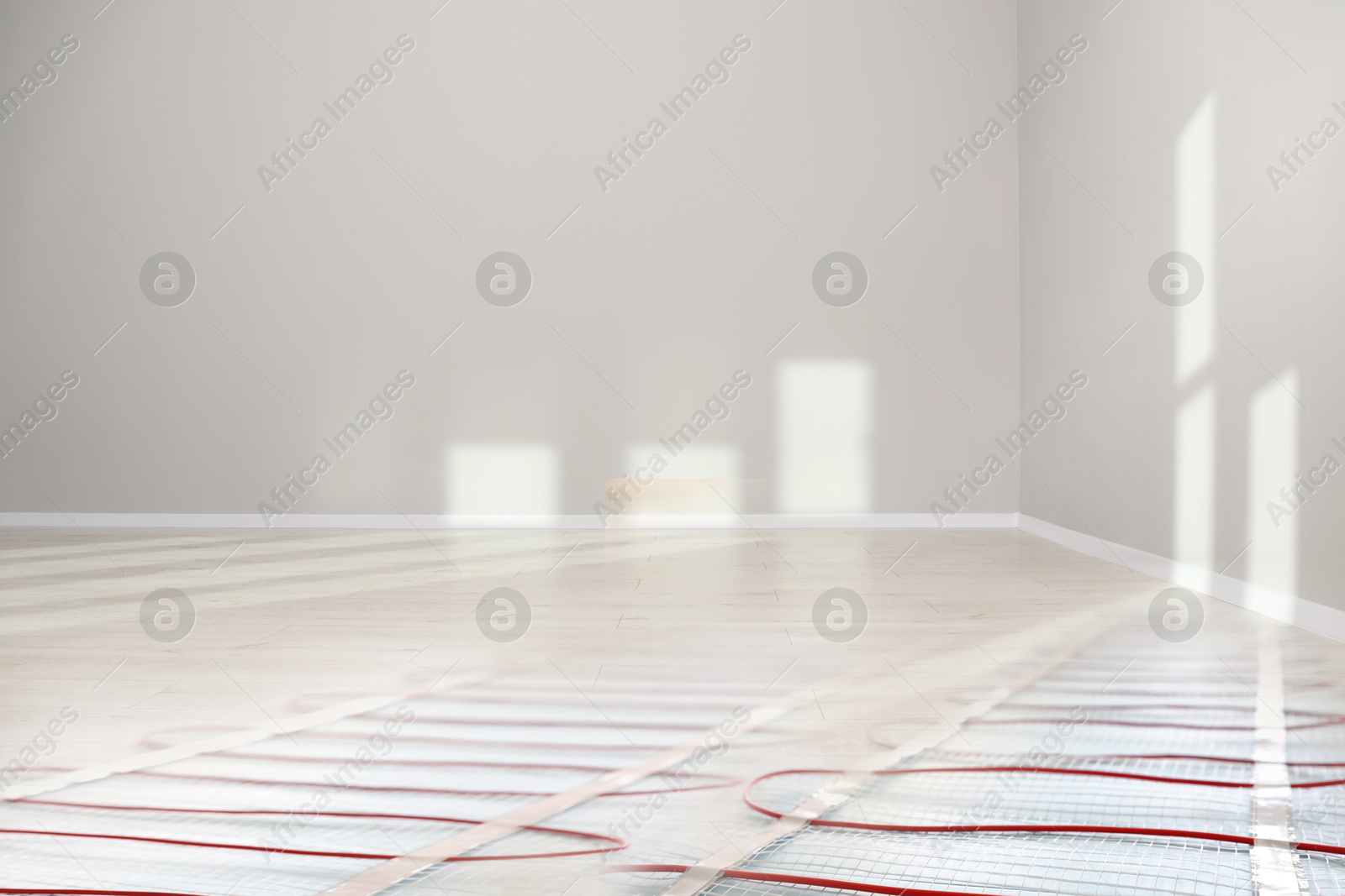 Underfloor heating system, double exposure with laminate floor in room Image of Underfloor heating system, double exposure with laminate floor in room
