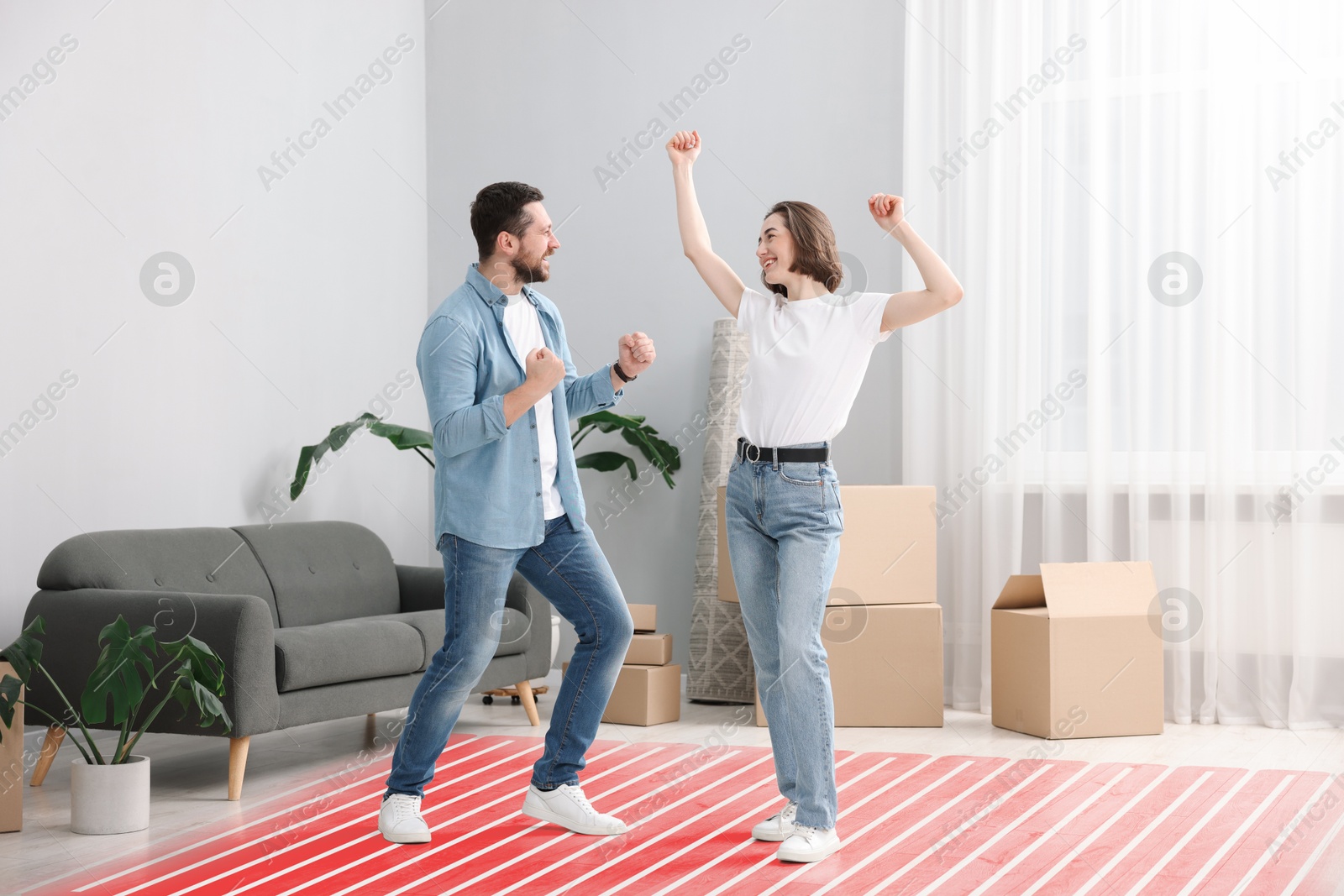 Couple dancing on warm floor at home, double exposure with underfloor heating system Image of Couple dancing on warm floor at home, double exposure with underfloor heating system