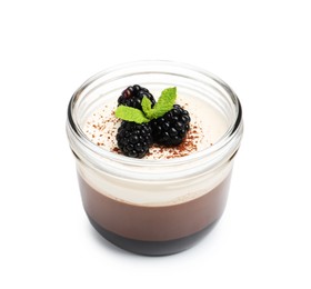 Photo of Tasty panna cotta with blackberries, mint and cocoa powder in jar isolated on white