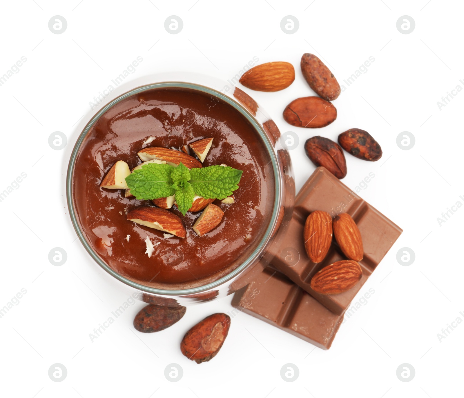 Photo of Delicious panna cotta with almonds, cocoa beans and chocolate pieces isolated on white, top view