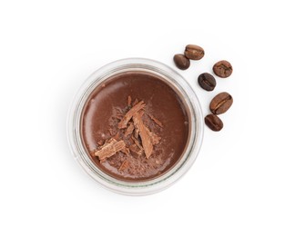 Photo of Delicious chocolate panna cotta in glass jar and coffee beans isolated on white, top view