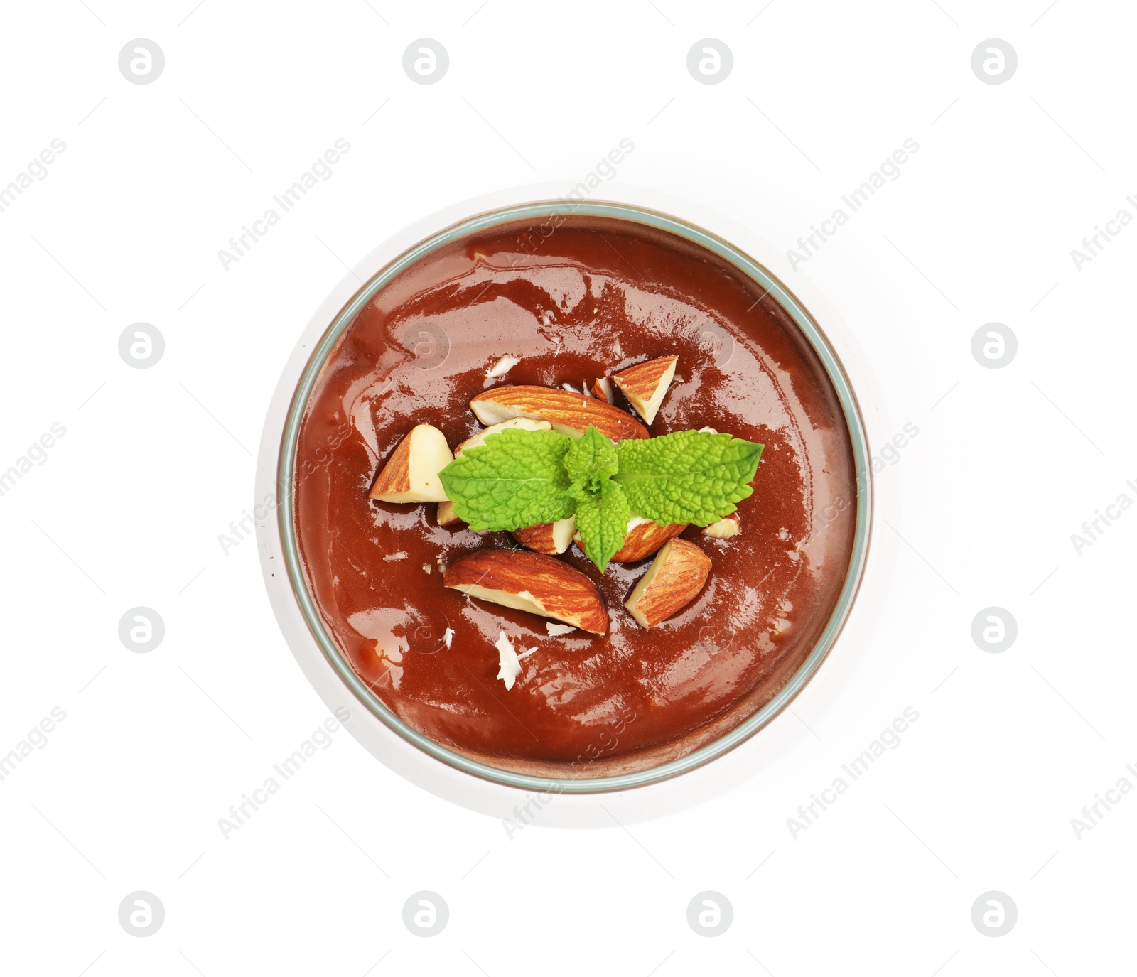 Photo of Delicious chocolate panna cotta with almonds and mint in glass isolated on white, top view