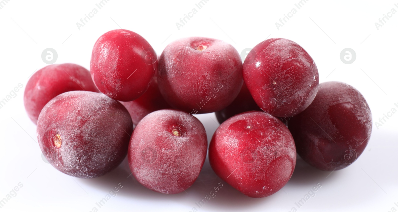 Photo of Pile of ripe frozen cherries on white background, closeup