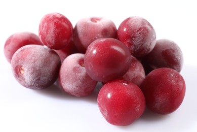 Photo of Pile of ripe frozen cherries on white background, closeup
