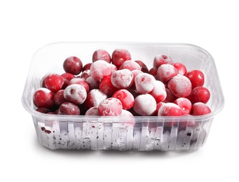 Photo of Ripe frozen cherries in plastic container isolated on white