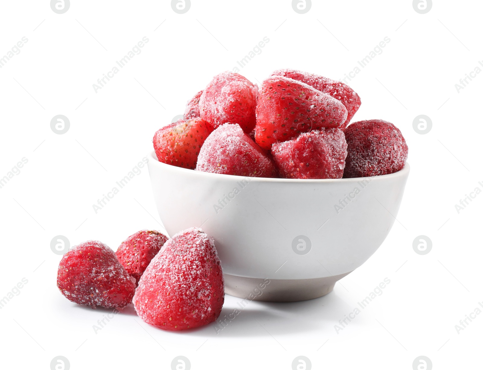 Photo of Ripe frozen strawberries and bowl isolated on white