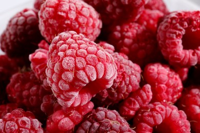 Photo of Many ripe frozen raspberries as background, closeup