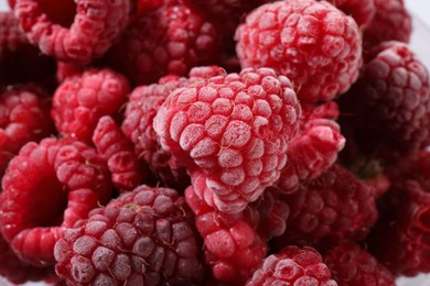 Photo of Many ripe frozen raspberries as background, closeup