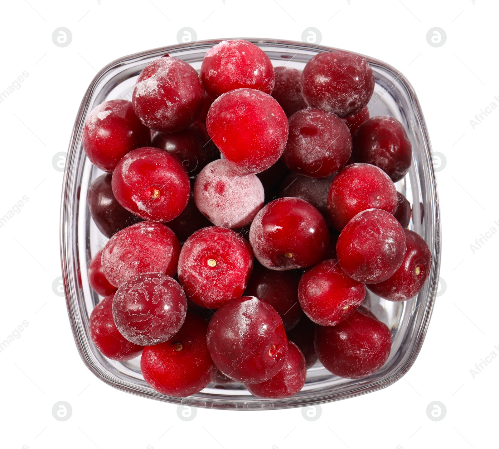 Photo of Ripe frozen cherries in bowl isolated on white, top view