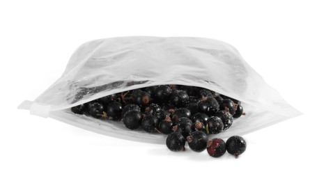 Photo of Ripe frozen black currants in open zipper bag isolated on white