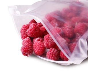 Photo of Ripe frozen raspberries in open zipper bag isolated on white