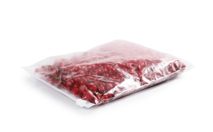 Photo of Ripe frozen red currants in plastic bag isolated on white