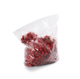 Photo of Ripe frozen red currants in plastic bag isolated on white