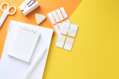 Photo of White stationery on color background, flat lay. Space for text