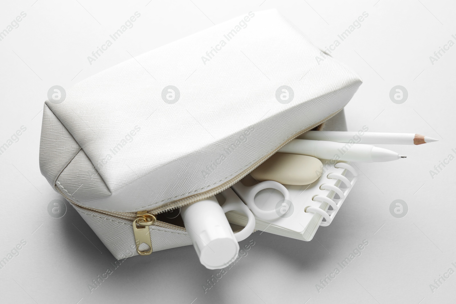 Photo of White stationery on light grey background, closeup