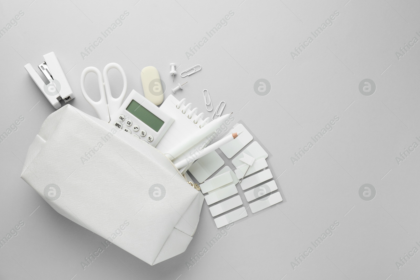 Photo of White stationery on light grey background, flat lay. Space for text