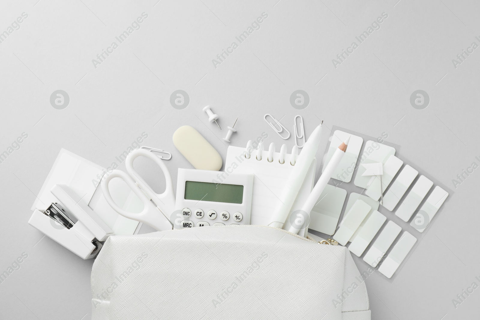 Photo of White stationery on light grey background, flat lay. Space for text