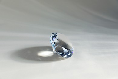 Photo of Aura. One beautiful diamond on light background